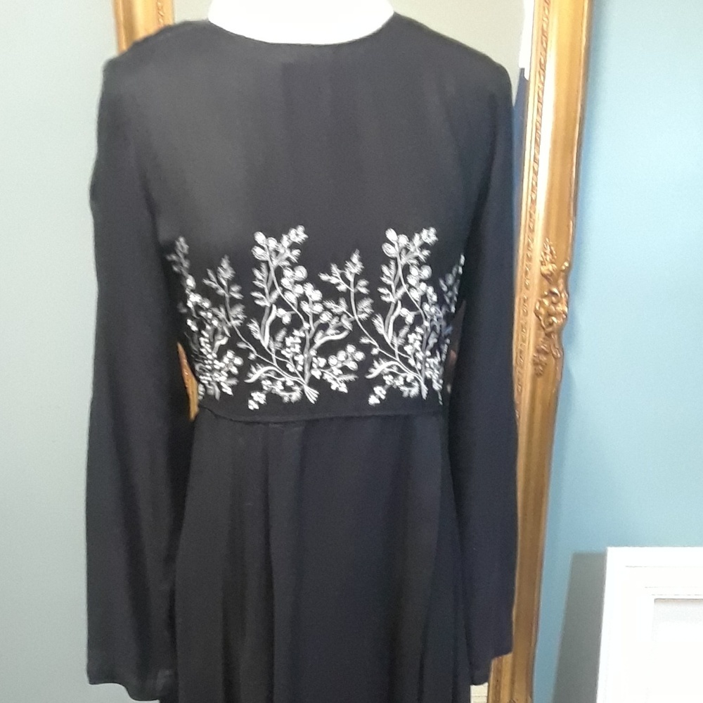 Black dress with white flowers and small pearls